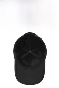 Detailed macro view of the warm black fleece lining and reinforced cross-stitching on the cap