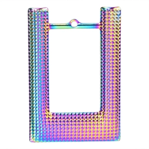 Macro detail of rainbow plated stainless steel pendant frame with dotted relief texture