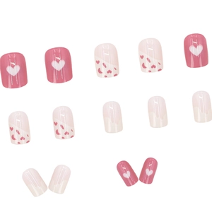 Pink and white heart pattern press-on nails with sweet glossy graffiti design