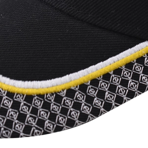 Detailed macro view of black twill baseball cap brim with CA letter embroidery