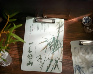 Detail of Chinese style acrylic clipboard with green bamboo motif and classic calligraphy