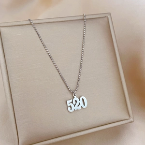 Silver 520 numeric pendant necklace with bead chain in a beige jewelry box