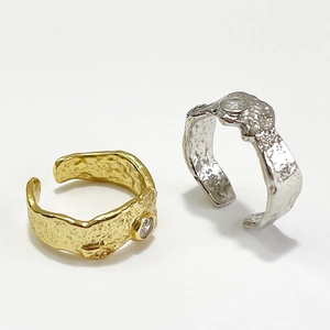 Irregular hammered texture open rings in gold and silver with round cubic zirconia