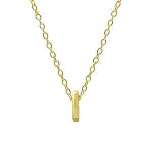 Macro shot of 925 sterling silver golden chain with a small rectangular pendant on white