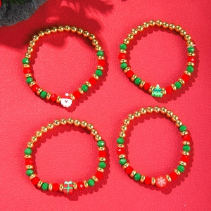 Detail of Christmas beaded bracelet set with Santa, tree, and snowflake charms