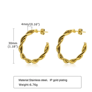 Detailed macro view of 30mm gold twisted rope hoop earrings in stainless steel