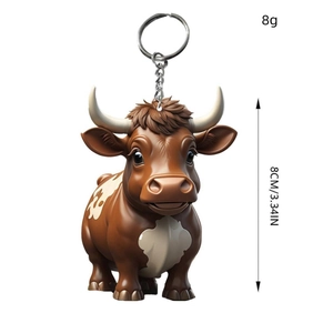 Cartoon highland cow keychain 3D yak bag pendant in brown with white spots, 8cm tall