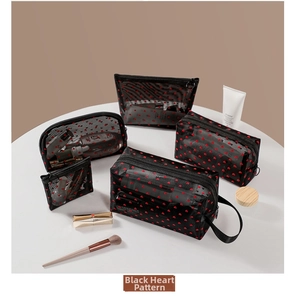 Detailed set of black mesh cosmetic bags with red heart patterns in five varied sizes
