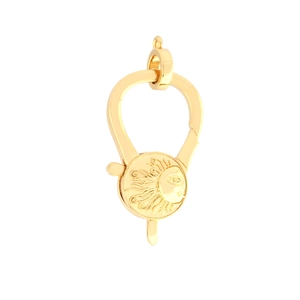 Detailed view of a gold-plated sun face pendant clasp with intricate relief carvings