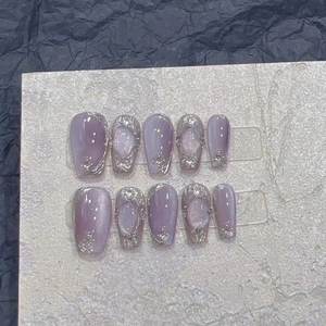 Detail of lavender press-on nails with silver glitter and trapezoid shape