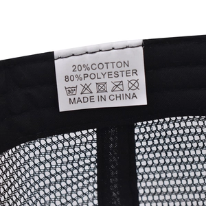 Detail of baseball cap care label showing 20% cotton and 80% polyester material blend