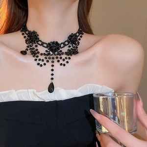Detail of Gothic black beaded flower choker with layered fringe and teardrop crystal pendant