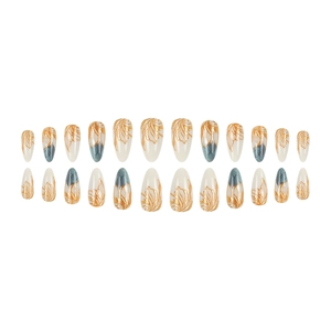 White almond press-on nails with gold embossed leaf patterns and marble texture