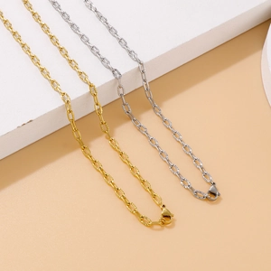 Golden and silver chunky hammered texture oval link chain necklaces set on beige background