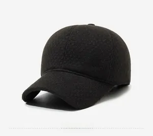 Detail of wool blend baseball cap showing metal logo plate and thick warm winter fabric