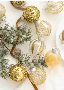 Detailed view of 6cm gold and champagne Christmas ornaments with sequins and mesh textures