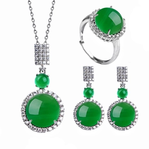 Detail of green chalcedony jewelry set with silver necklace, ring, and earrings