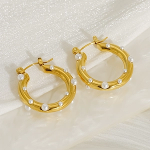 18K gold plated stainless steel hoop earrings with elegant pearl inlays on white fabric