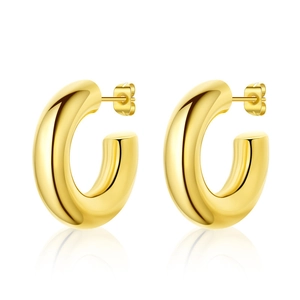 Detailed close-up of chunky gold-plated C-shaped hoop earrings with a polished finish