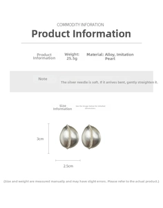 Detail view of silver teardrop earrings featuring a row of inlaid pearls and size markings