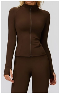 Detail view of athletic jacket thumbhole cuffs and high-neck zipper in dark coffee brown