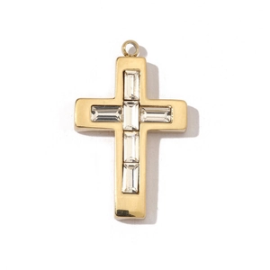 Close-up of golden stainless steel cross pendant with rectangular zircon stones