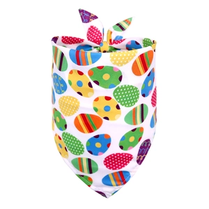 Detail of white Easter dog bandana with colorful retro egg patterns and knot design