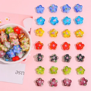 Colorful plum blossom glass beads for DIY jewelry making displayed in a white bowl