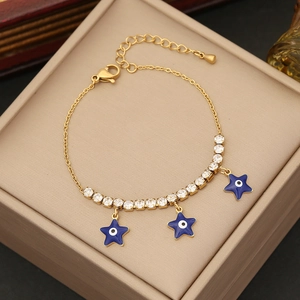 Golden chain bracelet with blue evil eye star charms and sparkling white rhinestones