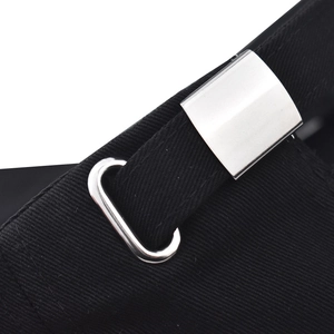 Detail of adjustable metal buckle and black washed cotton fabric on baseball cap