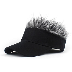 Detail view of creative black sun visor hat with greyish-white synthetic hair wig decoration