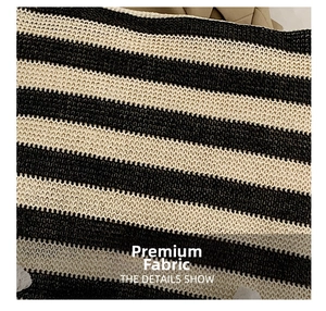 Close-up of the woven texture on a black and white striped knit tote bag fabric
