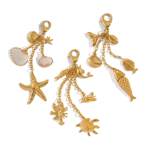 Detailed close-up of marine ocean charms with starfish and seashell on lobster clasps