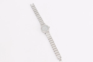 Detail of luxury women quartz watch with full crystal rhinestones and silver metal strap
