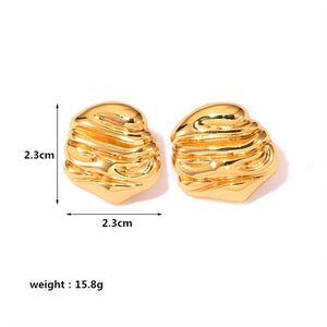 Detail view of gold textured earrings with lava pattern and precise size measurements