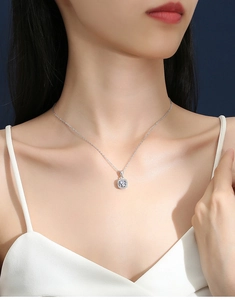 Elegant model wearing a S925 silver necklace featuring a square moissanite pendant