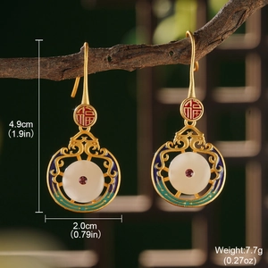 Vintage Chinese earrings with white disk, red ruby, and green enamel on a wooden branch