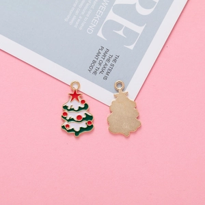 Detailed view of dual-sided Christmas tree charms with colorful enamel and gold metal finish