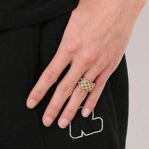 Close-up of hip-hop men's hollow Cuban chain ring with sparkling crystals and gold tones
