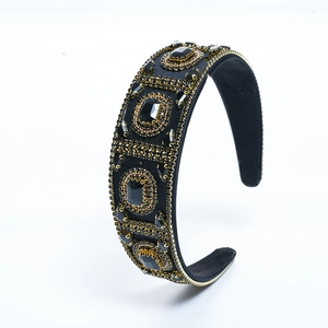 Luxury Baroque headband with black gemstones and gold beads on a wide black band