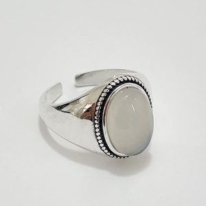 925 sterling silver open ring featuring a large oval white agate with beaded edge detail
