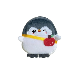 Cute gray plush penguin coin purse featuring a red apple detail and yellow strap
