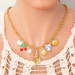 Chunky 18k gold plated necklace with starfish shell and cherry pendants on lace top
