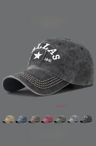Detail view of washed cotton baseball caps with Dallas 1841 embroidery in eight colors