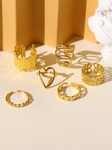 Set of six gold vintage rings featuring heart and chain designs for women's fashion