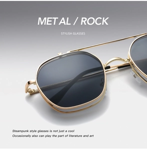 Close-up of steampunk style gold metal frame and black lenses on retro punk sunglasses