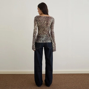 Sexy leopard print mesh long sleeve t-shirt paired with dark blue wide leg denim jeans