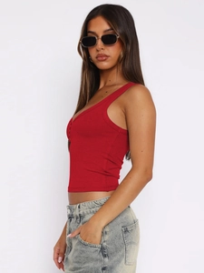 Close-up of red ribbed knit crop top featuring a slim fit and U-neckline style