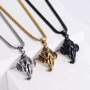 Detailed view of Ganesha elephant pendants in silver, gold, and black plated steel