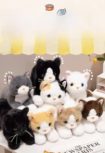 Detailed view of various realistic plush cats in diverse colors for home decoration